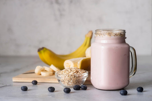 a glass of protein smoothie with high protein content with banana