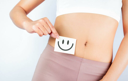happy stomach with smiley on the paper near  the stomach to describe that not all protein cause bloating