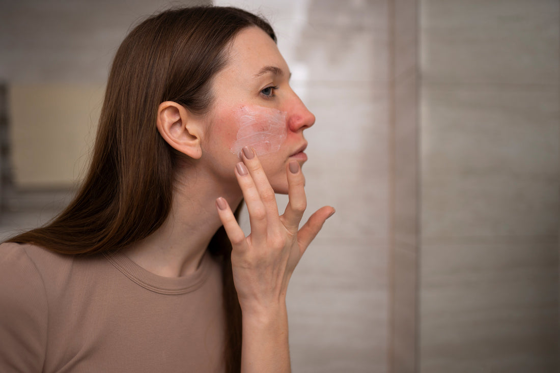 repair skin barrier. a women touch her cheek and observe the redness on her face