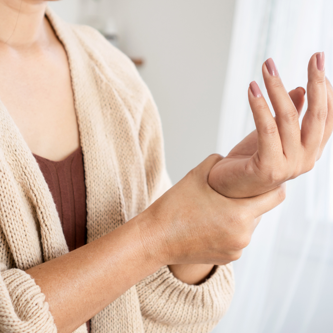 women tough her hand wrist